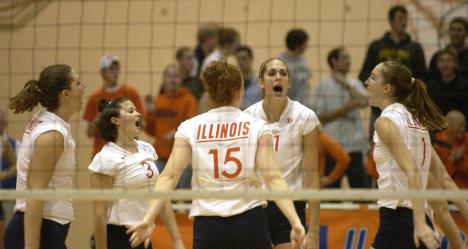 The volleyball team pumps themselves up before they start game four against Indiana on October 25, 2003, at Huff Hall. Carol Matteucci
