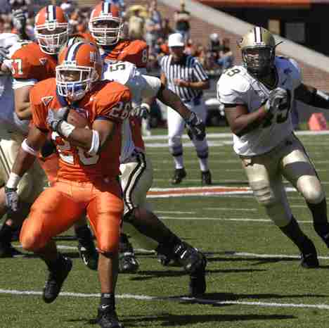 E.B. Halsey (26) outruns Purdue in the beginning of the third quarter Saturday at Memorial Stadium. The drive ended with a blocked field goal, and Illinois lost 38-30. Carol Matteucci
