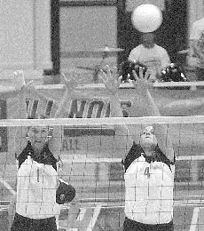 Jessica Belter (1) and Meghan Macdonald (4) block a Miami of Ohio hit on Friday at Huff Hall. Illinois went on to win their match 3-0 and the 21st Annual State Farm Illini Classic. Lauren Lenkowski
