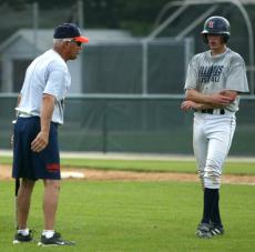 Head coach Richard Itch Jones gives instruction to Shawn Roof at Illinois Field on Monday. Online Poster
