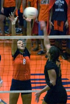 Illinois defensive specialist Rasa Virsilaite attempts to block a USC spike Saturday at Huff Hall. Illinois defeated USC in five sets. Online Poster
