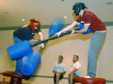 Byron Blair, left, senior in LAS, and Martin Froehlich, graduate student, compete in an Illinites jousting game Friday at the Union. Lauren Lenkowski
