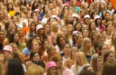 Women sit in Huff Hall waiting to get bids for their respective sororities on Sunday, the last day of sorority recruitment. Online Poster
