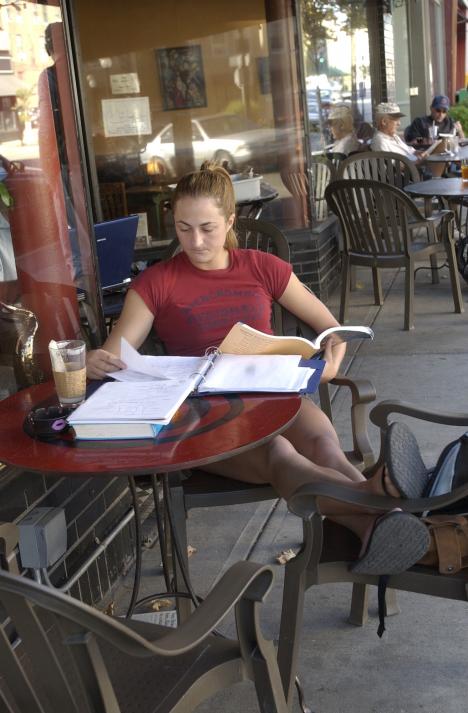 Lindsey Tanner, senior in LAS, studies anatomy outside Cafe Kopi in downtown Champaign on Monday afternoon. I can´t study in my apartment; it´s too small, so I come here and get coffee to study, Tanner said. Shira Weissman
