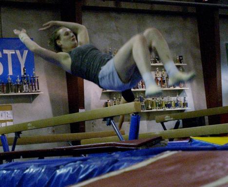 Jenny Keen of Champaign flips during Adult Tumbling at the Champaign County YMCA on Monday night. Keen is an employee of the YMCA and misses doing gymnastics after practicing since grade school. The Adult Tumbling class is from 7:30 p.m. till 9:00 p.m. on Carol Matteucci
