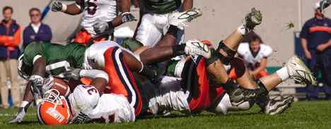 Illinois´ Justin Harrison gets tackled against Michigan State on Saturday, Oct. 9, at Spartan Stadium in East Lansing, Mich. Illinois lost 38-25. Carol Matteucci
