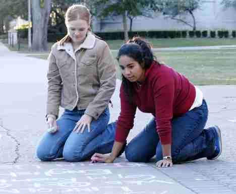 Sophomore in LAS Samantha Bartos, left, and freshman in LAS Cassandra Di Prizio chalk the Quad on Monday evening for the Pre-law Club. The Pre-law Club is having meetings tomorrow at 7:30 p.m. in 196 Lincoln Hall and on Wednesday at 6:00 p.m. in 160 Engli Carol Matteucci
