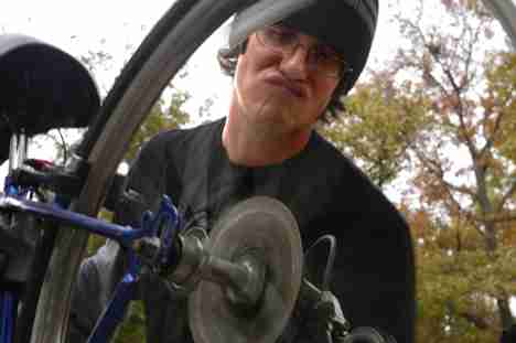 Graduate student Mike Keller does a bike tune-up on the Quad Thursday. Keller said the tune-ups, sponsored by Students for Environmental Concerns and Illinois Bicycle Racing Club, were raising money to support racers. Dan McDonald

