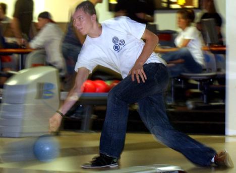 ohn-Paul Deddens, sophomore in engineering, bowls on Lane 3 at the Illini Union Bowling Alley Thursday night. Deddens bowled a 130. Online Poster
