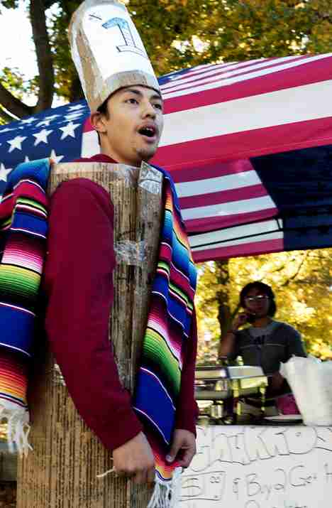 Mario Alvarado, freshman in engineering, plays Churroman on Monday as he wanders the Quad advertising churros being sold for the Society of Hispanic Professional Engineers. Carol Matteucci
