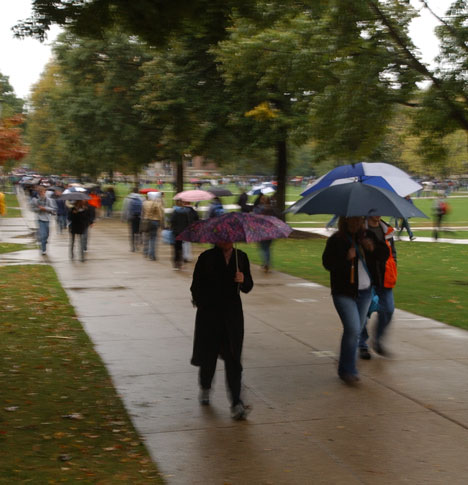 Students walk in the rain Monday on the Quad. The forecast predicts rain later in the week as well. Shira Weissman