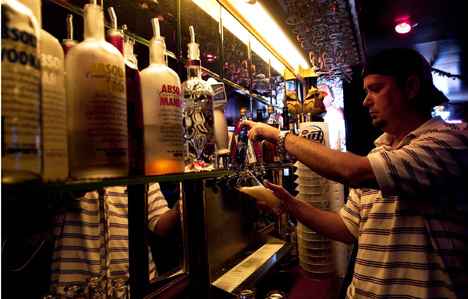 Todd Rentfrow, a Geovanti´s bartender, pours a beer for fellow bartender Kelly Danlow, senior in LAS, Tuesday evening at Geovanti´s Bar and Grill, 401 E. Green St. in Champaign. The bar section of the restaurant opened in June and will be host Online Poster
