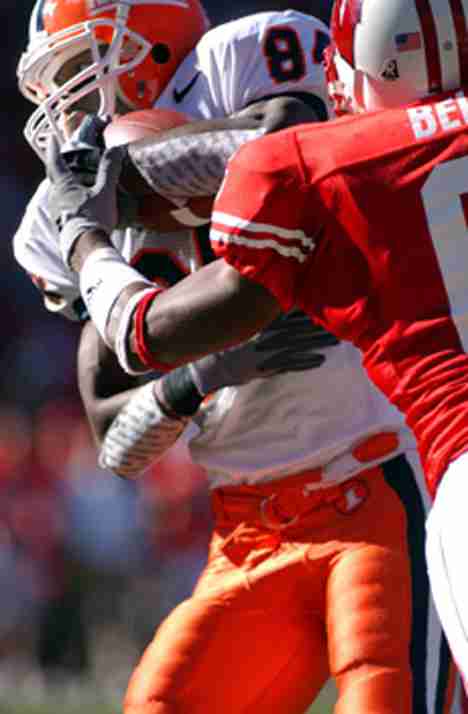 Illinois wide receiver Kendrick Jones (84) is tackled by Wisconsin´s Brett Bell (6) Saturday at Camp Randell Stadium in Madison, Wis. Wisconsin defeated Illinois 24-7. Shira Weissman
