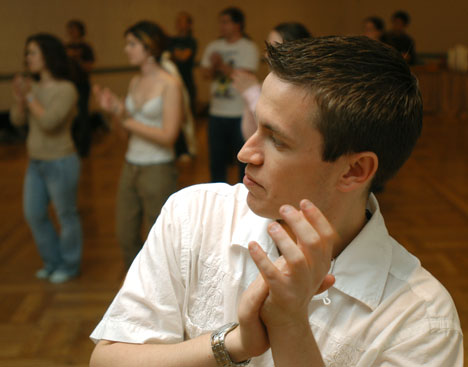 Steven Benario, freshman in engineering, dances at a cultural event hosted by the North American Jewish Student Association in Illini Union Room B on Tuesday night. Students learned a number of traditional Jewish dances, such as Yoya and Mayim. Online Poster
