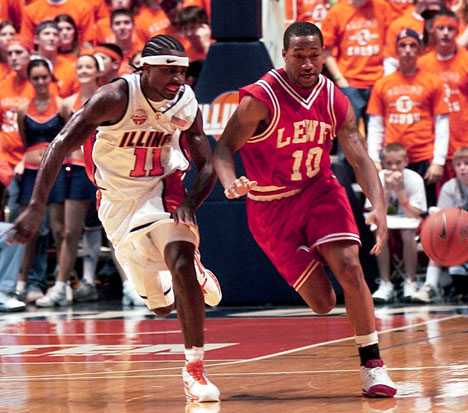 Illinois guard Dee Brown (11) races to the ball against Lewis State´s DeAndre Williams (10) Sunday at Assembly Hall. Illinois defeated Lewis 92-61. Online Poster
