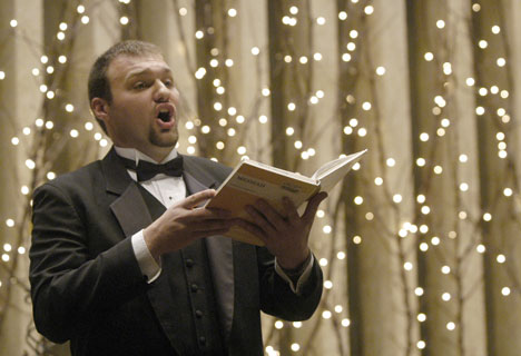 Graduate student John Green performs a solo during a sing-along of Handel´s Messiah put on Sunday by the Baroque Artists of Champaign-Urbana at the First United Methodist Church in Champaign. Online Poster

