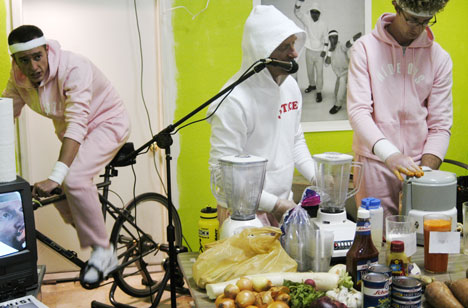 Kermit Gilbert lauds the qualities of freshly made juice while Josh Ippel operates the juicer, powered by Charlie Roderick´s biking, on Saturday at the Affordable Art Sale at the Open Source Gallery. The three graduate students were working together Online Poster
