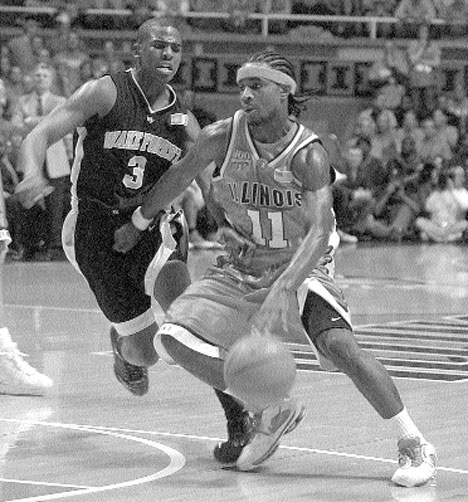 Illinois guard Dee Brown (11) drives to the basket against Chris Paul (3) of Wake Forest in the first half, Wednesday at Assembly Hall. Online Poster
