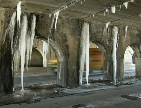 A vehicle passes under a viaduct with large icicles Monday on East Washington Street, Champaign. These icicles formed as water seeped through the cracks in the viaducts and froze. Tim Eggerding
