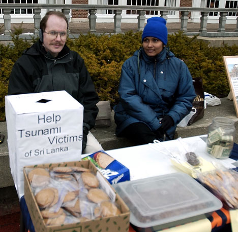 Andrew Trapp (left) and Indu Rupassara, president of the Sri Lankan Society, hold a bake sale Wednesday morning to help victims of the tsunami. Another two bake sales are scheduled for Jan. 26 and 28. Tim Eggerding
