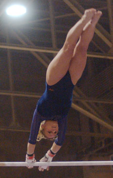 Danye Botterman performs on the uneven bars on Jan. 30 at Huff Hall. Illinois lost to Denver 195.025-194.150. Online Poster
