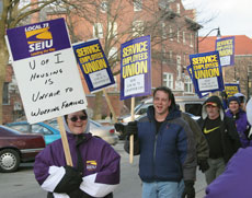 Members of the Service Employees Union Chapter 119 march outside the Swanlund Administration Building on Thursday in protest the Housing Divison´s decision to implement a seven-day work schedule in which employees, instead of getting the weekends of Online Poster
