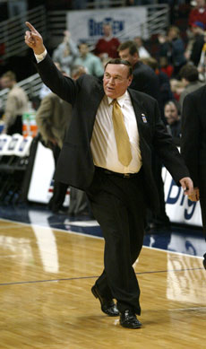 Purdue head coach Gene Keady points to the stands in acknowledgement of the cheering fans as he steps off the floor for the last time as head coach after Purdue´s loss to Iowa 71-52 at the United Center in Chicago. Online Poster
