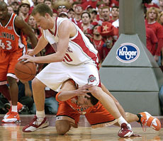Ohio State forward Matt Sylvester gets control of a loose ball over Illinois´ James Augustine in the first half of Sunday´s game at Value City Arena. Sylvester led Ohio State with 25 points, which included the game winning three pointer with e Online Poster
