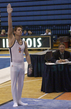 Illinois gymnast Justin Spring prepares to compete on the parallel bars Feb. 12 at Huff Hall. Online Poster
