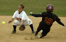 Illinois´ Angelena Mexicano (9) catches the ball to tag out a Loyola-Chicago player during Wednesday´s doubleheader at Eichelberger Field. Illinois won both games, 8-0 and 10-1. Online Poster
