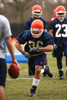 E.B. Halsey does a running drill during the Illinois football team´s first practice on Tuesday, March 30, at the practice field Online Poster
