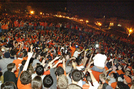 Illinois fans celebrate on the steps of Foellinger Auditorium and the Quad Saturday after Illinois defeated Louisville in the Final Four. According to University Police approximately 8,000 to 10,000 fans celebrated in the streets of Champaign-Urbana and Online Poster
