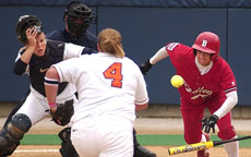 Illinois first baseman Jenna Hall (4) and catcher Julie Balicki go after a bunt by Bradley´s Sarah Mancuso Thursday at Eichelberger Field. Online Poster
