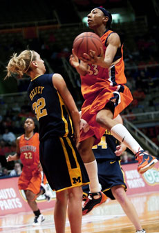 Angelina Williams jumps above Michigan´s Kelly Helvey in the game on Feb. 27 at Assembly Hall. Online Poster
