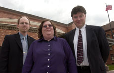 Champaign County Public Defenders Jeffrey Davis, Pam Burnside and Matthew Fitton stand in front of the Champaign County Courthouse at 101 E. Main St. in Urbana. Online Poster
