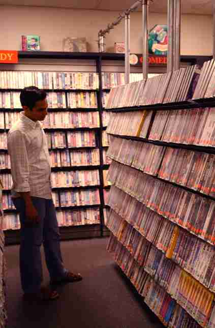 Puneet Sharma, graduate student in engineering, looks at the VHS tapes for sale Sunday afternoon at That´s Rentertainment! at the corner of John and Sixth Streets in Champaign. The independently owned movie store has decided to sell all of Its VHS t Tessa Pelias
