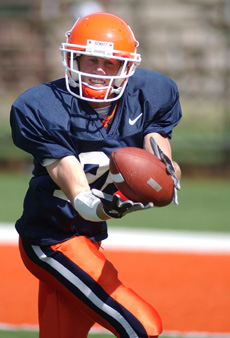 Wide receiver Kyle Hudson catches a pass during drills before a scrimmage game August 20 at Memorial Stadium. Online Poster
