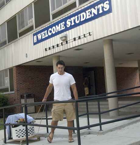 Jordan Wojcik, sophomore in LAS, moves into Garner Hall in Champaign Sunday afternoon. This year the University Residence Halls had all of the freshman move in on Saturday and everyone else move in Sunday to ease the congestion of move-in. Online Poster
