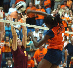Middle blocker Vicki Brown spikes the ball over the net at Illinois´ game against Loyola on Sept. 7 at Huff Hall. Tessa Pelias
