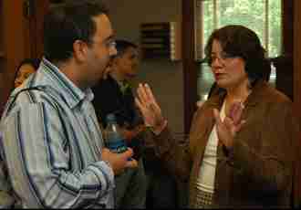 Latino History Professor Adrian Burgos (Left) speaks with Latino Studies Program Director Arlene Torres at the Latino Studies Open House on Friday. Vadim Olen
