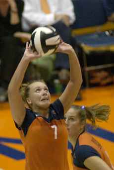 Illinois setter Stephanie Obermeier (7) sets the ball during play Sept. 7 in a match against Loyola at Huff Hall. Illinois defeated Loyola 3-0. Dan McDonald
