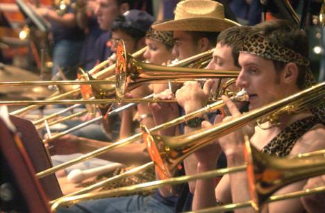 (From right) Greg Dorgan, Harrison Kaplin, Andy Sturgeon and Emily Packer play trombones during the Women´s Basketball Orange and Blue Scrimmage at Assembly Hall on Sunday. Tessa Pelias
