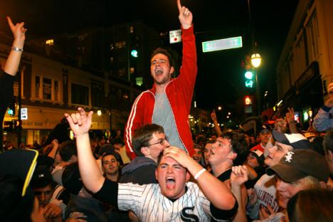 Hundreds of students celebrate at the intersection of Green and Sixth streets in Champaign after the Chicago White Sox won the World Series on Wednesday. The Sox swept the series against the Houston Astros in their first Series win since 1959. Josh Birnbaum
