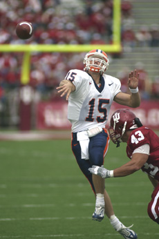 Illinois quarterback Tim Brasic releases a pass just before getting tackled by an Indiana defender Saturday in Bloomington, Ind. Peter Hoffman
