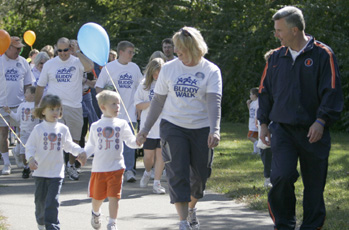Illinois Men´s Basketball coach Bruce Weber leads the first Buddy Walk of Champaign County on Saturday in Crystal Lake Park. The walk was one of many across the nation to shed light on Down syndrome awareness month this October. Adam Babcock
