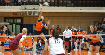 Rasa Virsilaite spikes the ball on a play during the first of four games in the match versus Minnesota at Huff Hall on Saturday. Illinois lost the game 30-27, and the match 3 games to 1. Peter Hoffman

