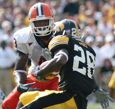 Illinois´ Sam Carson III prepares to tackle Iowa´s Damian Sims in the game against Iowa on Saturday at Kinnick Stadium in Iowa City. Illinois lost, 35-7. Troy Stanger
