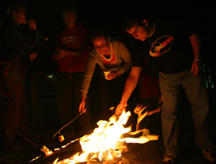 Brian Burns, freshman in Engineering, and Sarah Fuller, freshman in ALS, roast marshmallows at the Illini Grove on Tuesday night as part of the October Lovers´ annual Octoberfest event. You gotta love October, he said. October Lovers´ othe Josh Birnbaum
