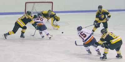 Joey Resch of Illinois hockey follows his shot on Lindenwood goaltender Grahame Lippert. Resch´s shot would become his first of three goals scored during Friday night´s game, contributing to the Illini´s 7-1 victory. Adam Babcock
