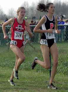Cassie Hunt runs neck and neck with Cack Ferrell of Princeton University at the NCAA Cross Country Championships in Terre Haute, Ind. on Nov. 21. Hunt placed 10th, and the Illinois women´s team placed 5th. Claire Napier
